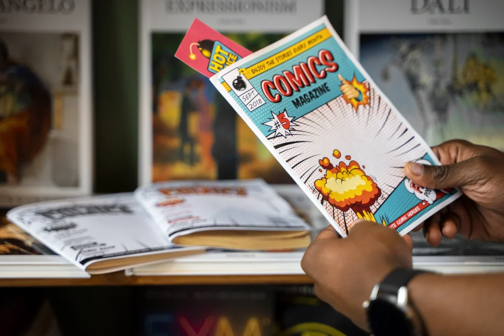 Close-up of hands holding a colorful comic