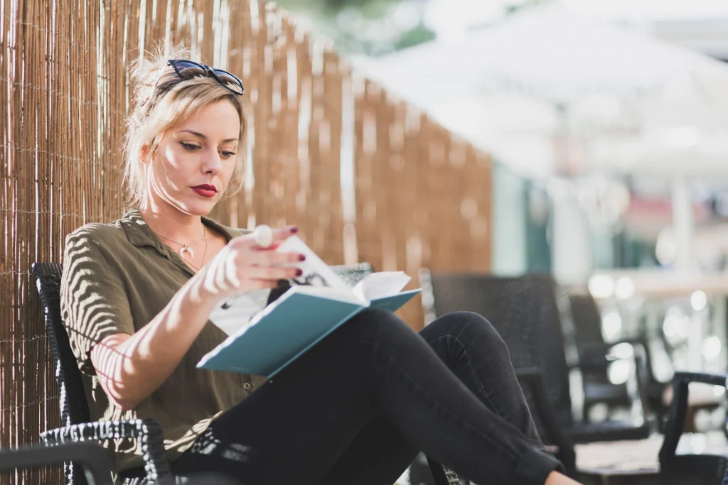 Woman working outdoors with clipboard