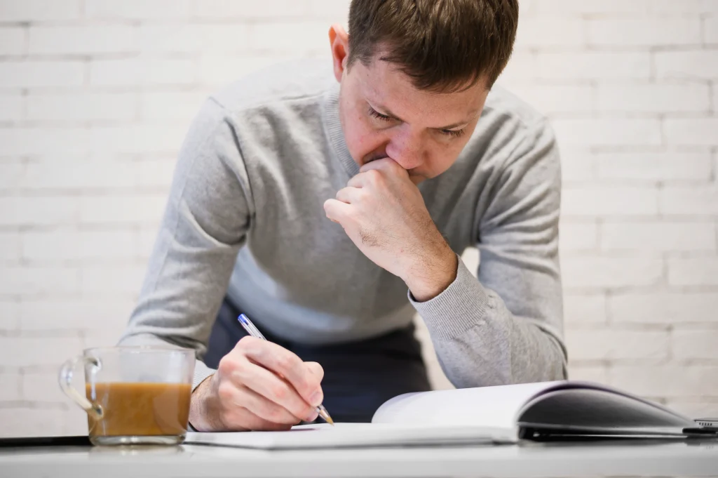 portrait-adult-male-taking-work-notes